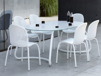 Loto Dinner table with tempered Float glass top & Aluminium legs.